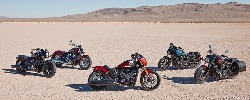 five Scout models parked on a desert