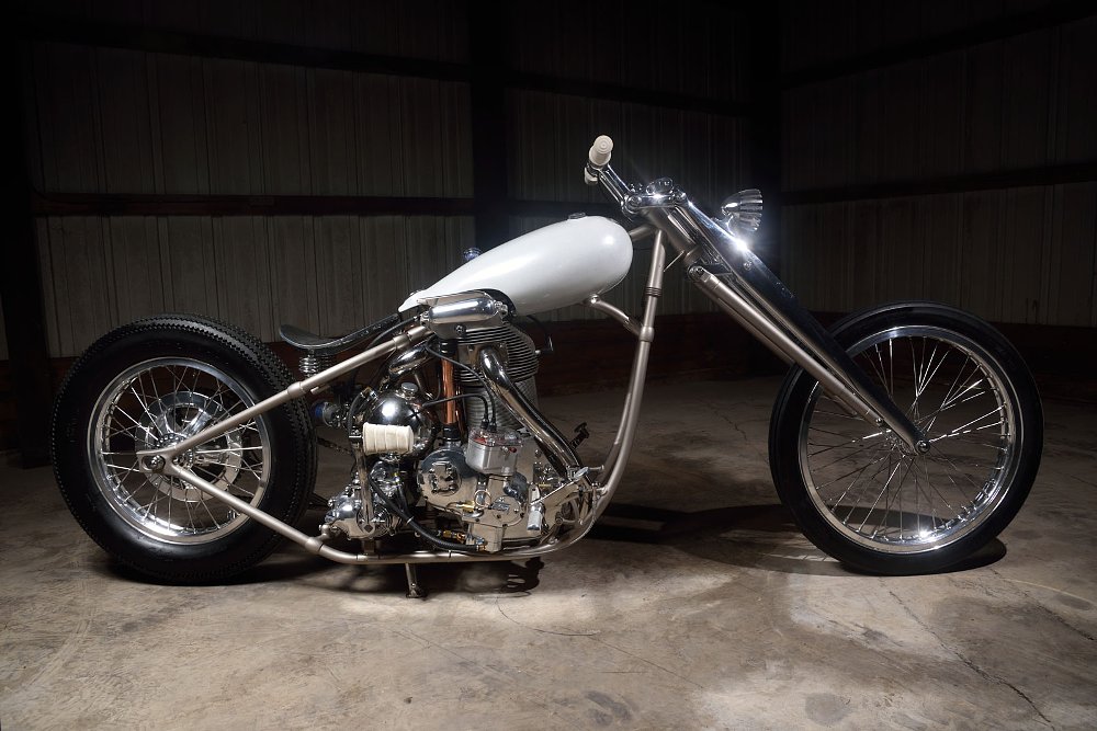 studio photo of the long silver chopper motorcycle