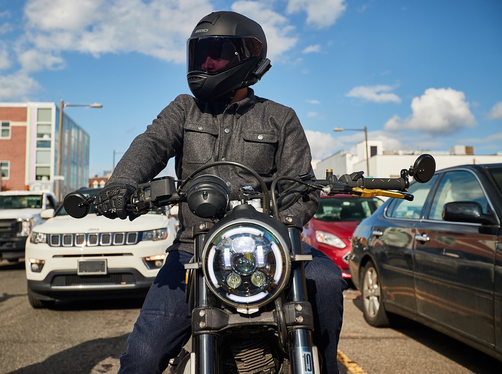 rider on a motorcycle in city traffic