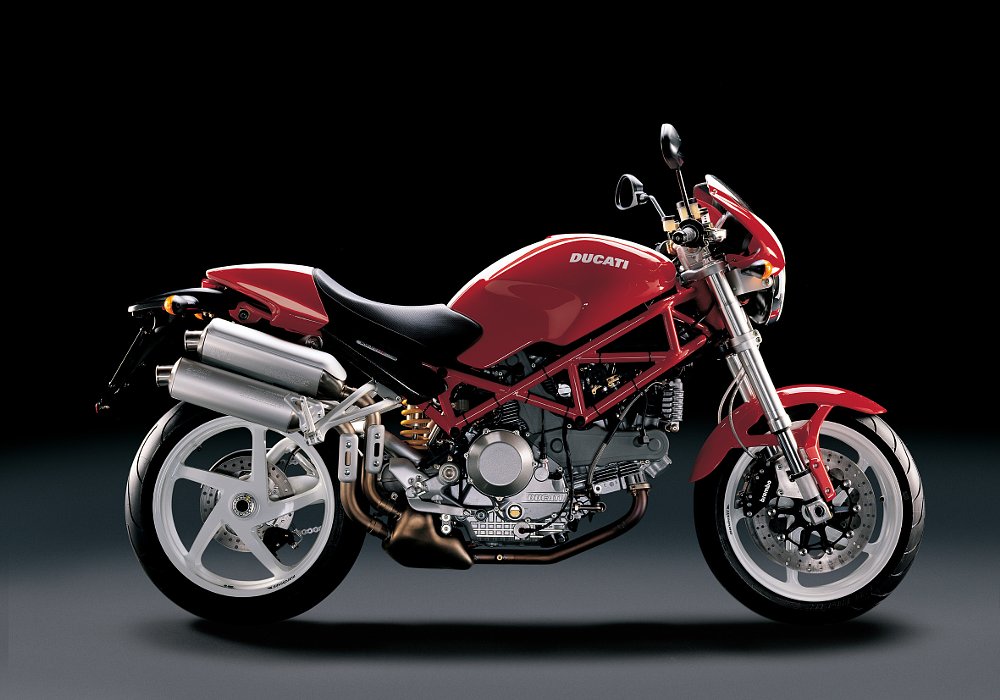 A 2007 Ducati Monster S2R 1000 in a black studio.