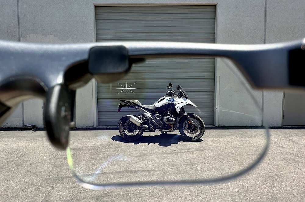 2024 BMW R 1300 GS seen through the lens of BMW's ConnectedRide Smartglasses, with a garage door as a background.