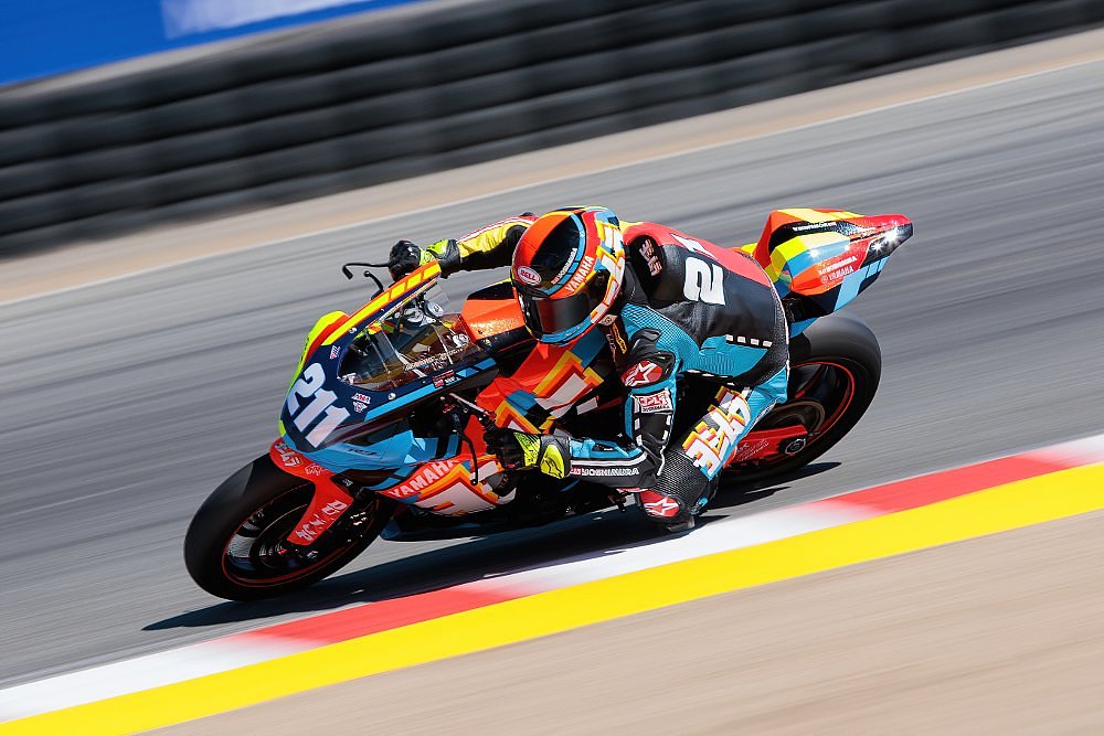 Ari Henning racing in colorful leathers on the R7