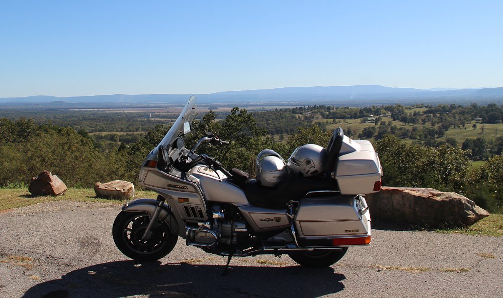 silver Gold Wing parked at a mountain overlook with distant mountains in the background