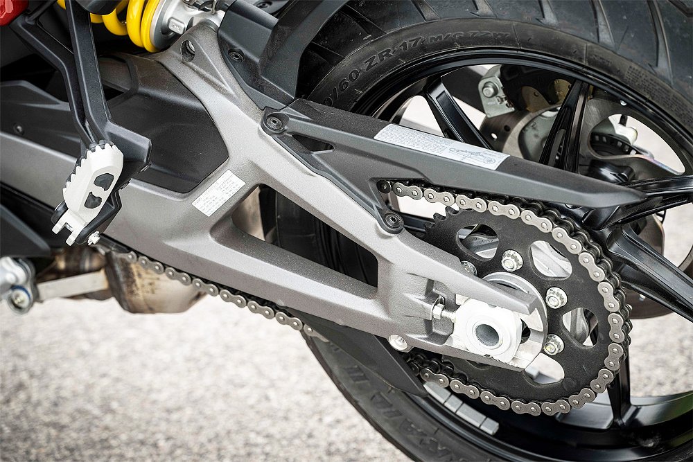 The swingarm attaches to the main frame via the rear shock.