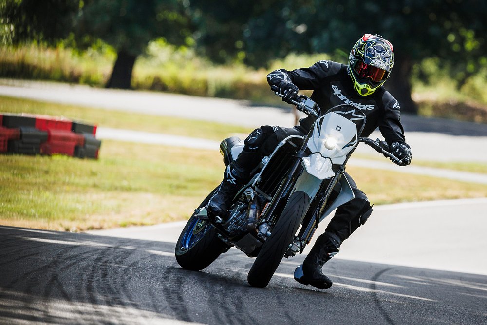 rider on the DR-Z4SM on the track, sliding the rear tire