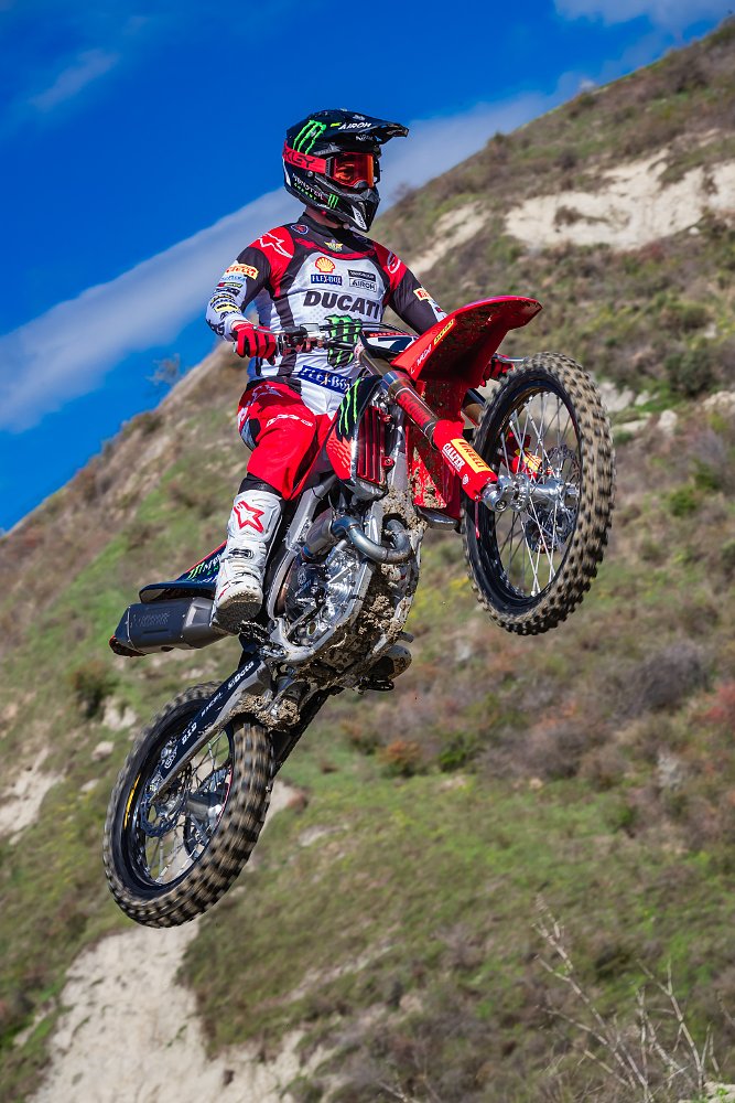 view from below of Lupino flying through the air on the Ducati motocross bike