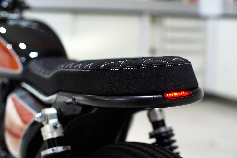 close up view of the rear of the seat with a small tail light embedded
