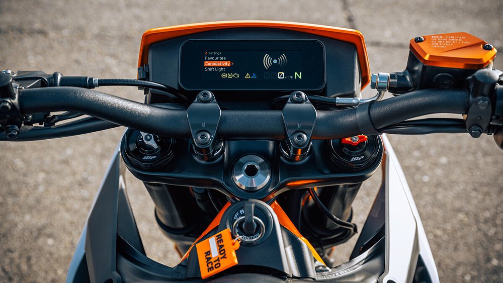 A photo of the KTM 390 SMC R's 4.2-inch TFT dash, pictured from the cockpit.