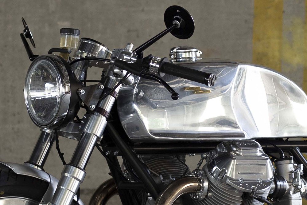 close view of the gleaming bare polished aluminum fuel tank