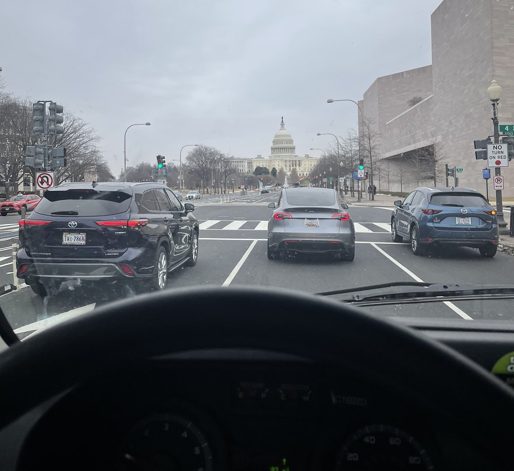 view from behind the wheel of the truck with the Capitol building far ahead