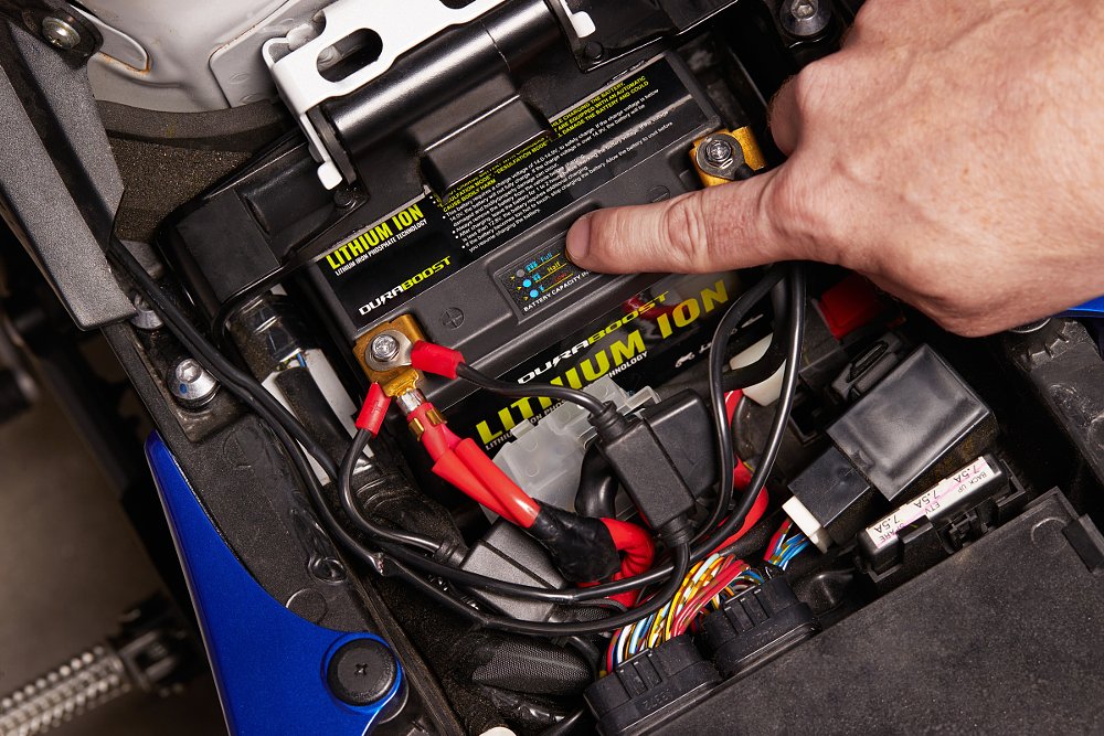 close view of a new battery with three leads attached to the positive terminal