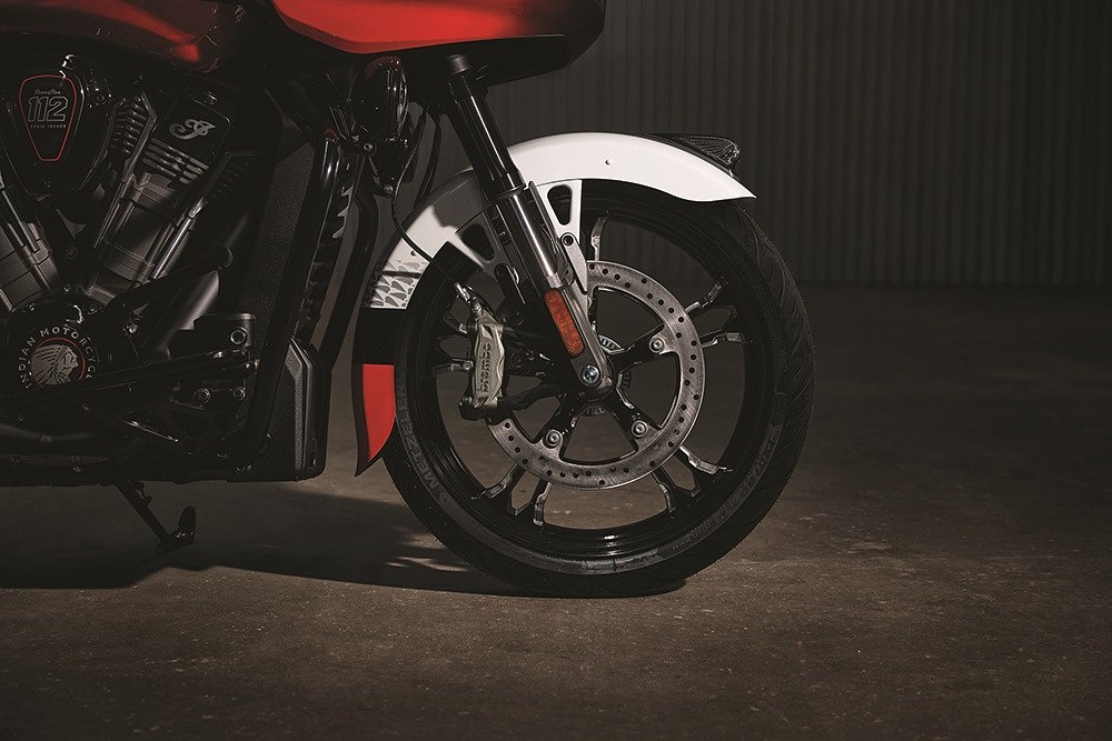 closeup studio photo of front wheel showing the Brembo brake calipers