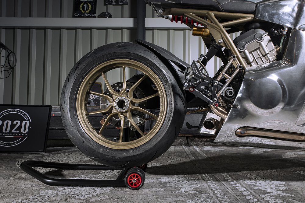 side view of the motorcycle showing the single-sided swingarm prominently