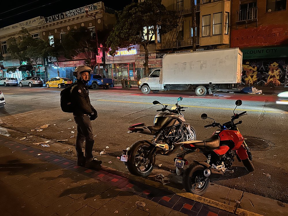 A Honda Grom and Zero S parked on Mission Street in San Francisco.