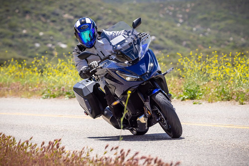 Dustin rides the NT1100 DCT through a sweeping corner.