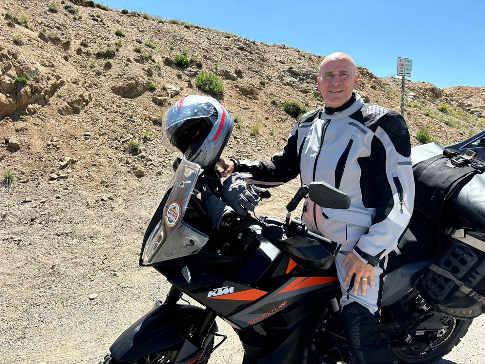 the author on a KTM in a western landscape