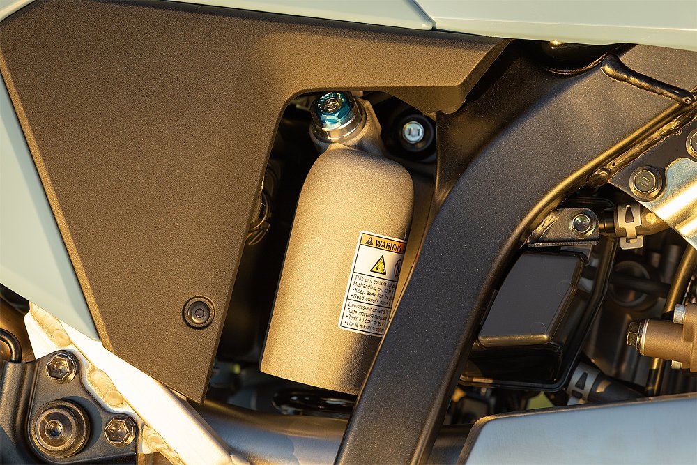 A close up of the DR-Z4SM's rear shock absorber.