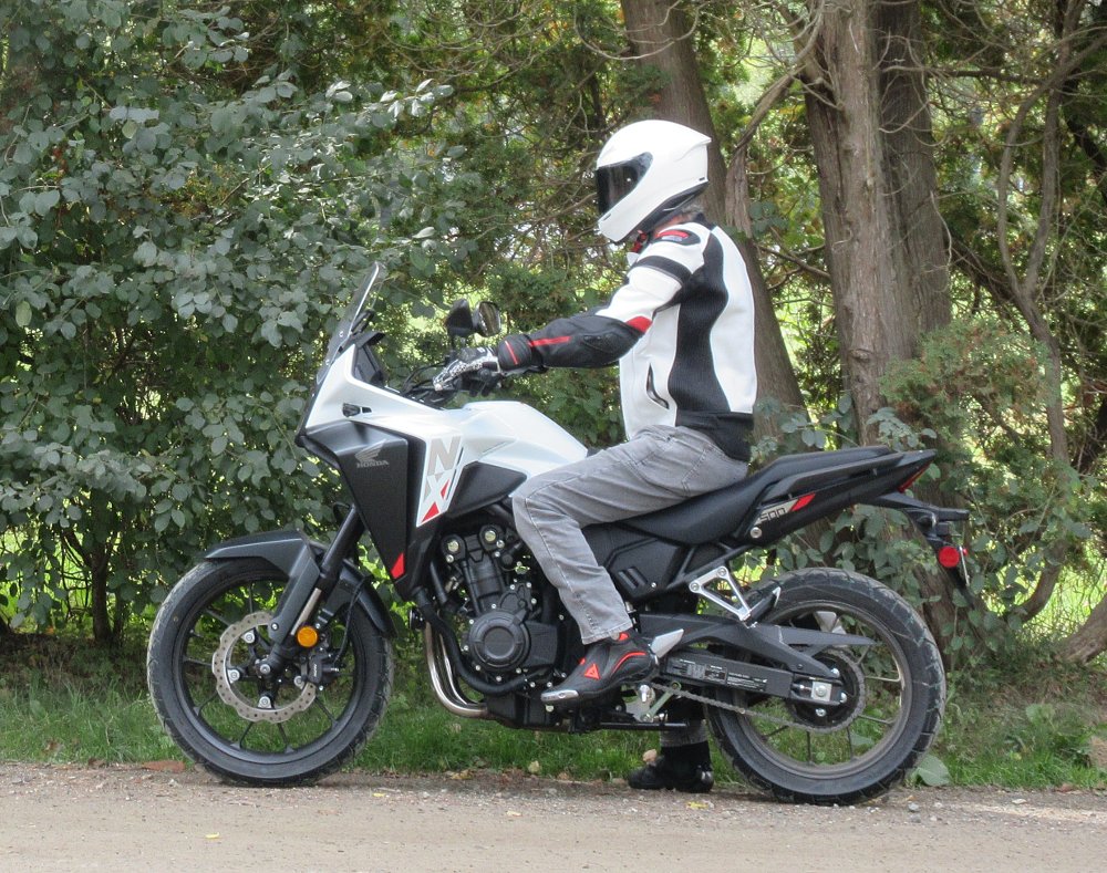 side view of rider on the NX500 showing the upright riding position