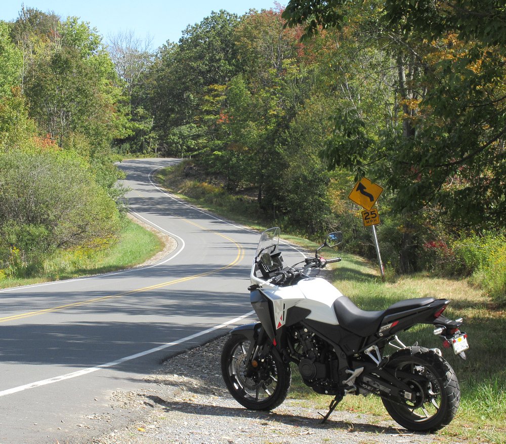 NX500 parked along a curvy country two-lane road