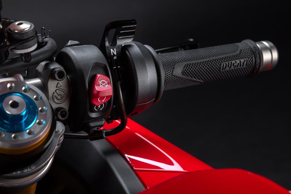 studio photo of right handgrip controls with a lever labeled 'N'