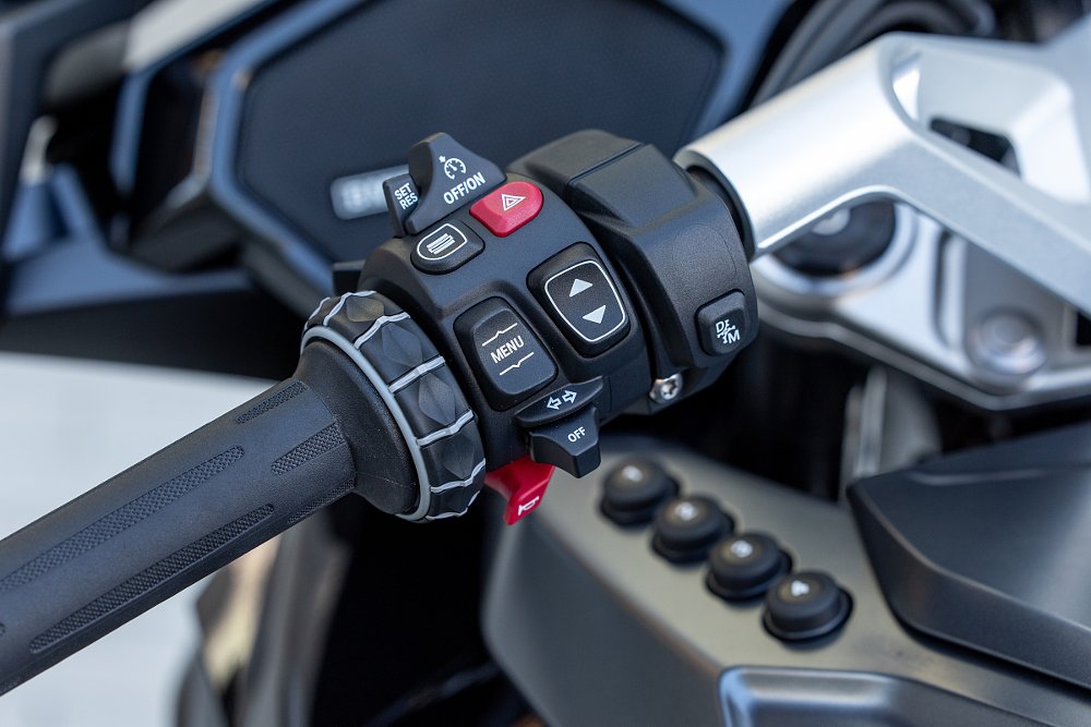 close view of the buttons and switches by the left hand grip