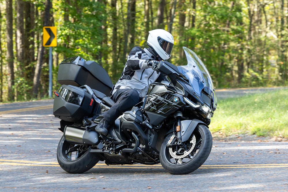 rider on the R 1300 RT in a curve in a forest